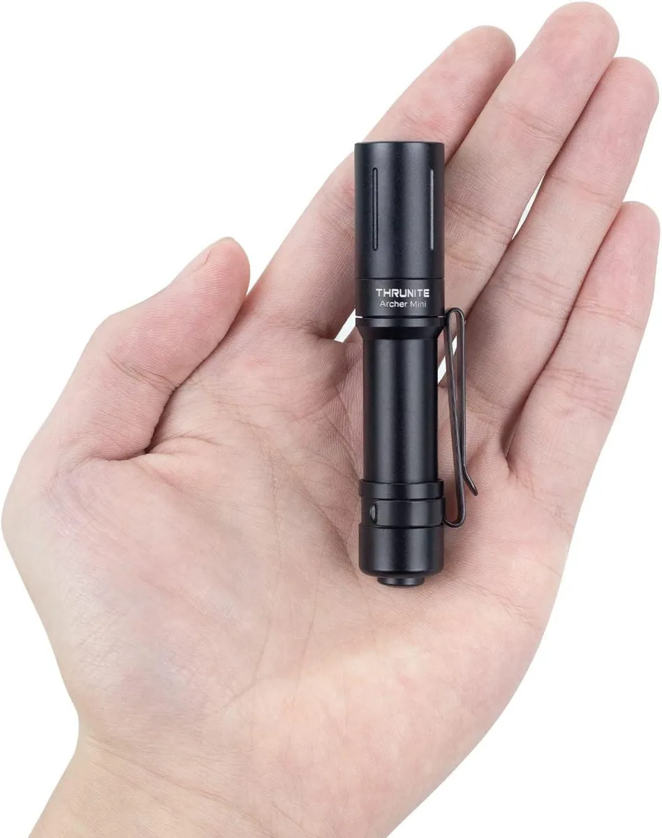 Small aluminium flashlight with pocket clip and hidden USB-C port