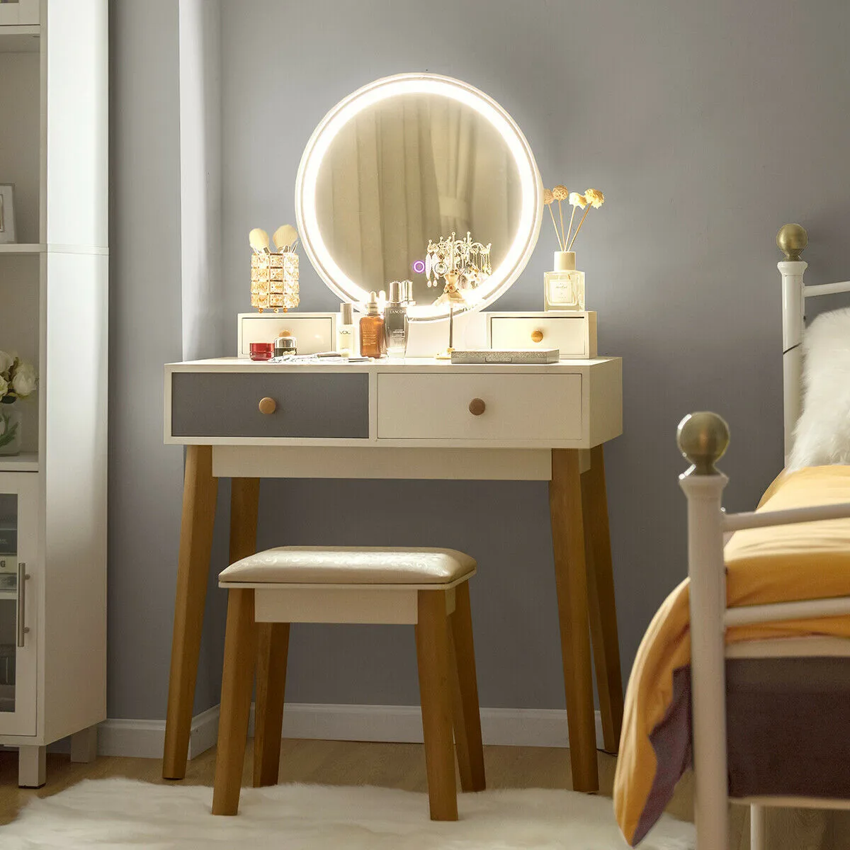 White vanity table set with round mirror, touch lighting, four drawers and matching stool
