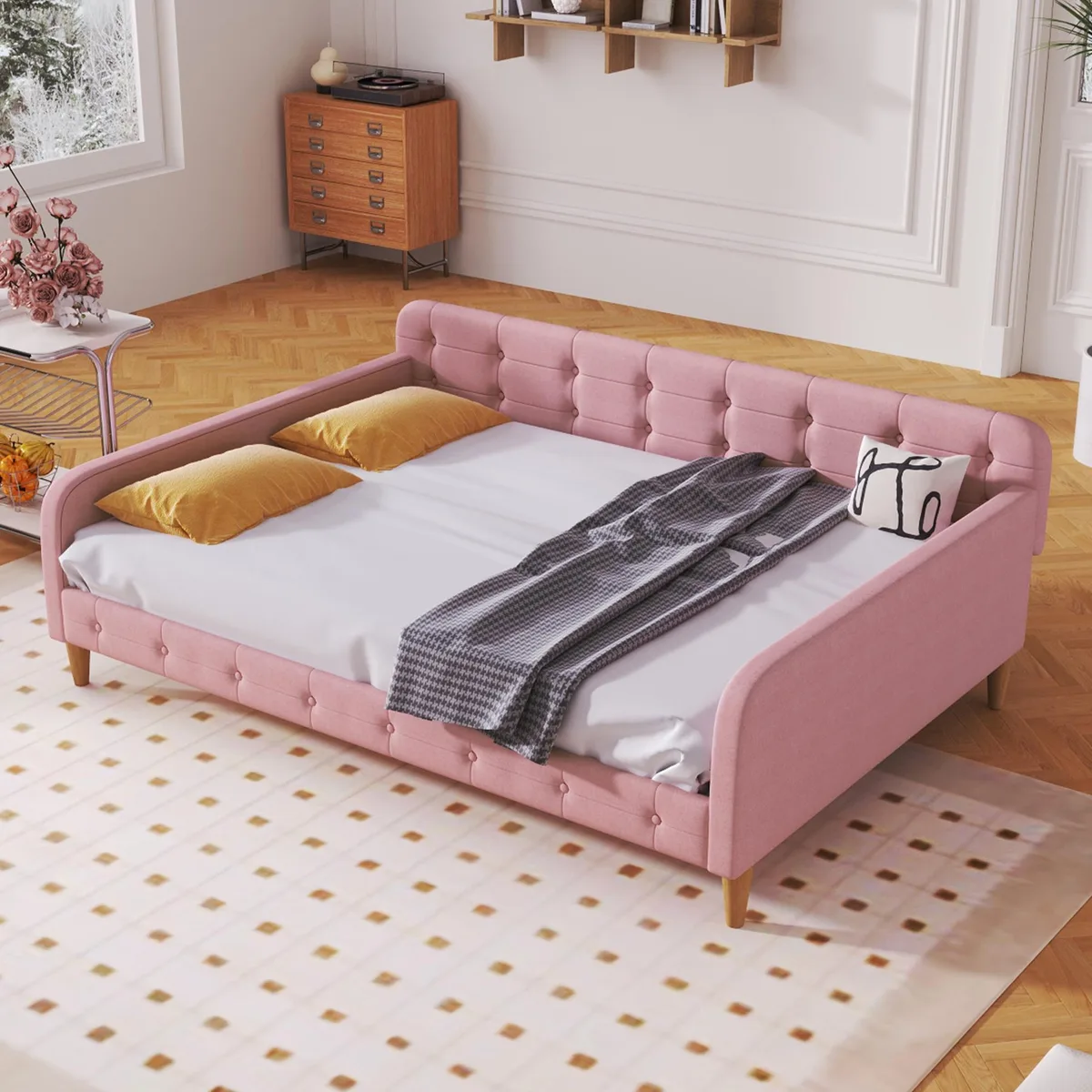 Pink upholstered full size daybed with four support legs
