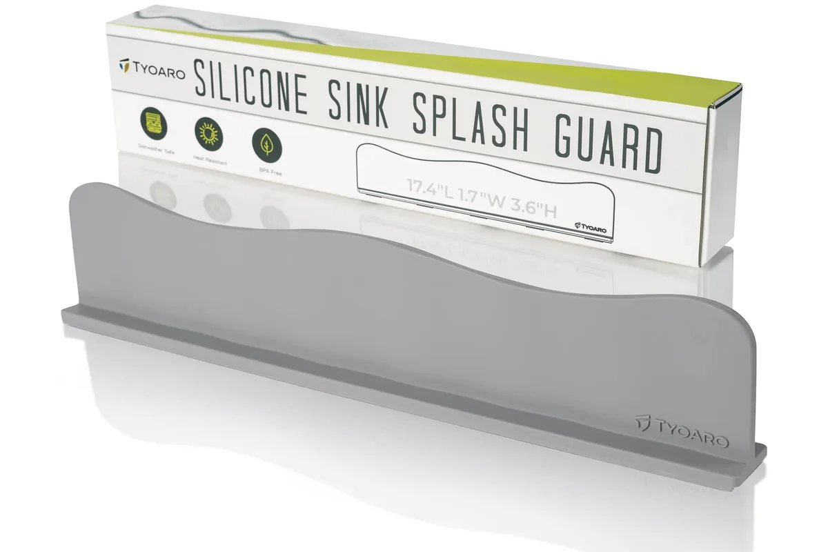 Gray flexible silicone splash guard with ergonomic wave shape and suction-cup base, 17.4 x 1.7 x 3.6 in