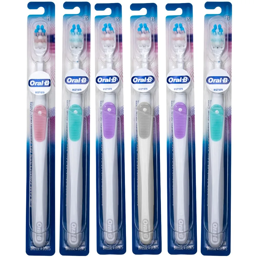 Six white compact toothbrushes with ultra-soft bristles in a pack