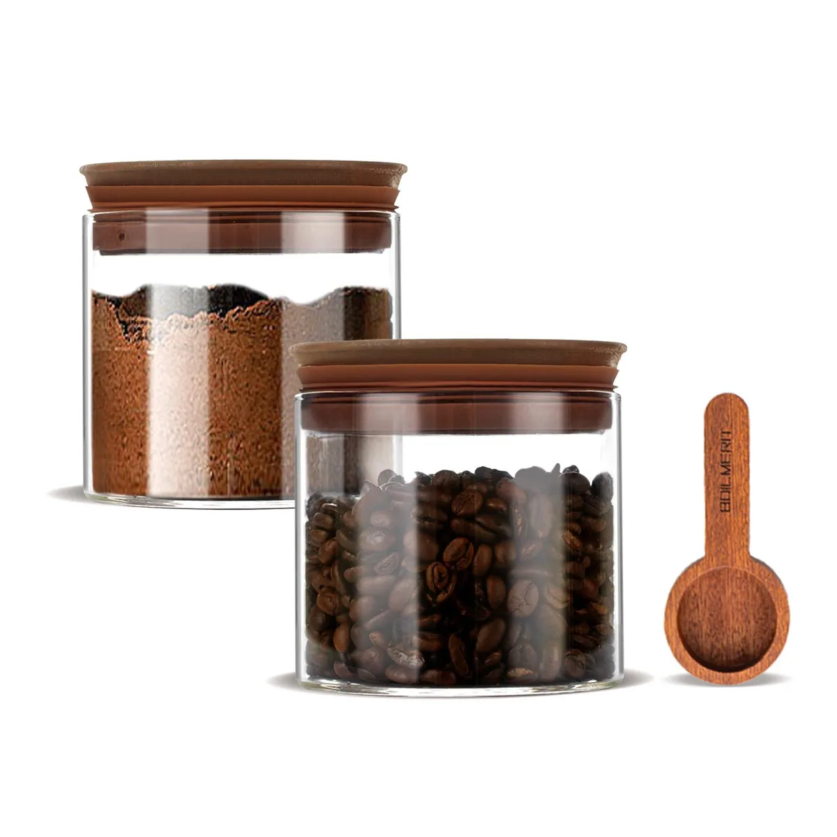 Two clear glass jars with wooden lids and scoops on a countertop