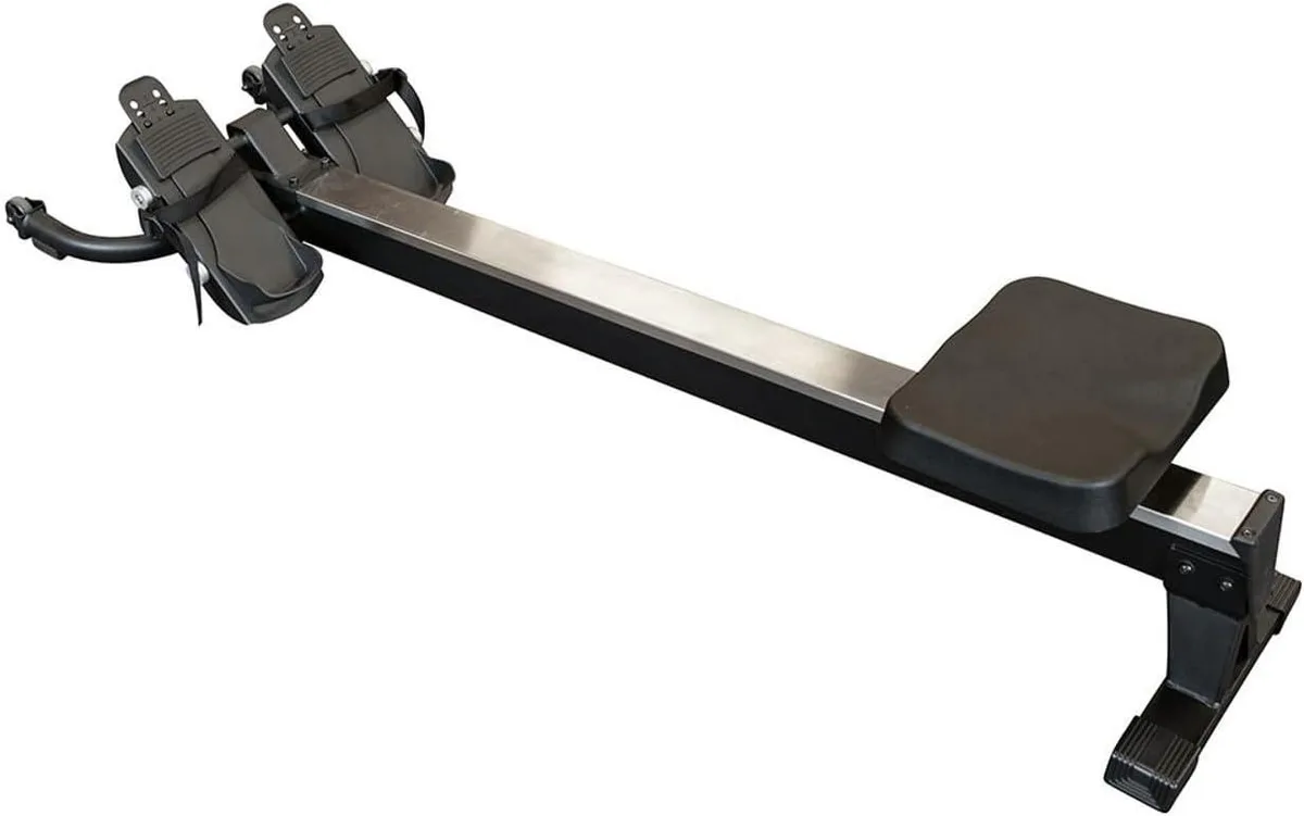 Black metal rower attachment with padded seat and sliding rail, designed for cable pulley systems