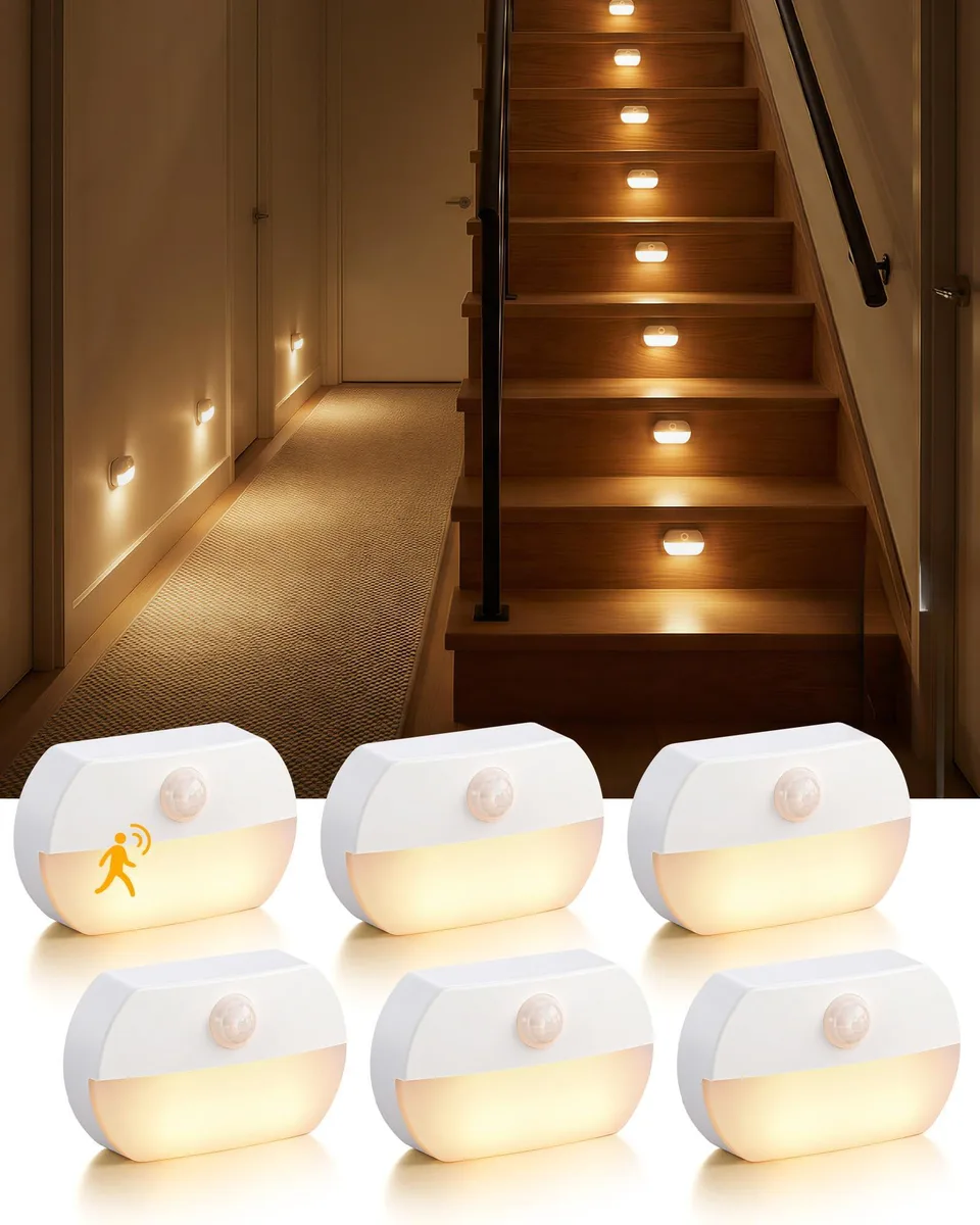 Two white plastic wall lights with magnetic mounts and adhesive pads