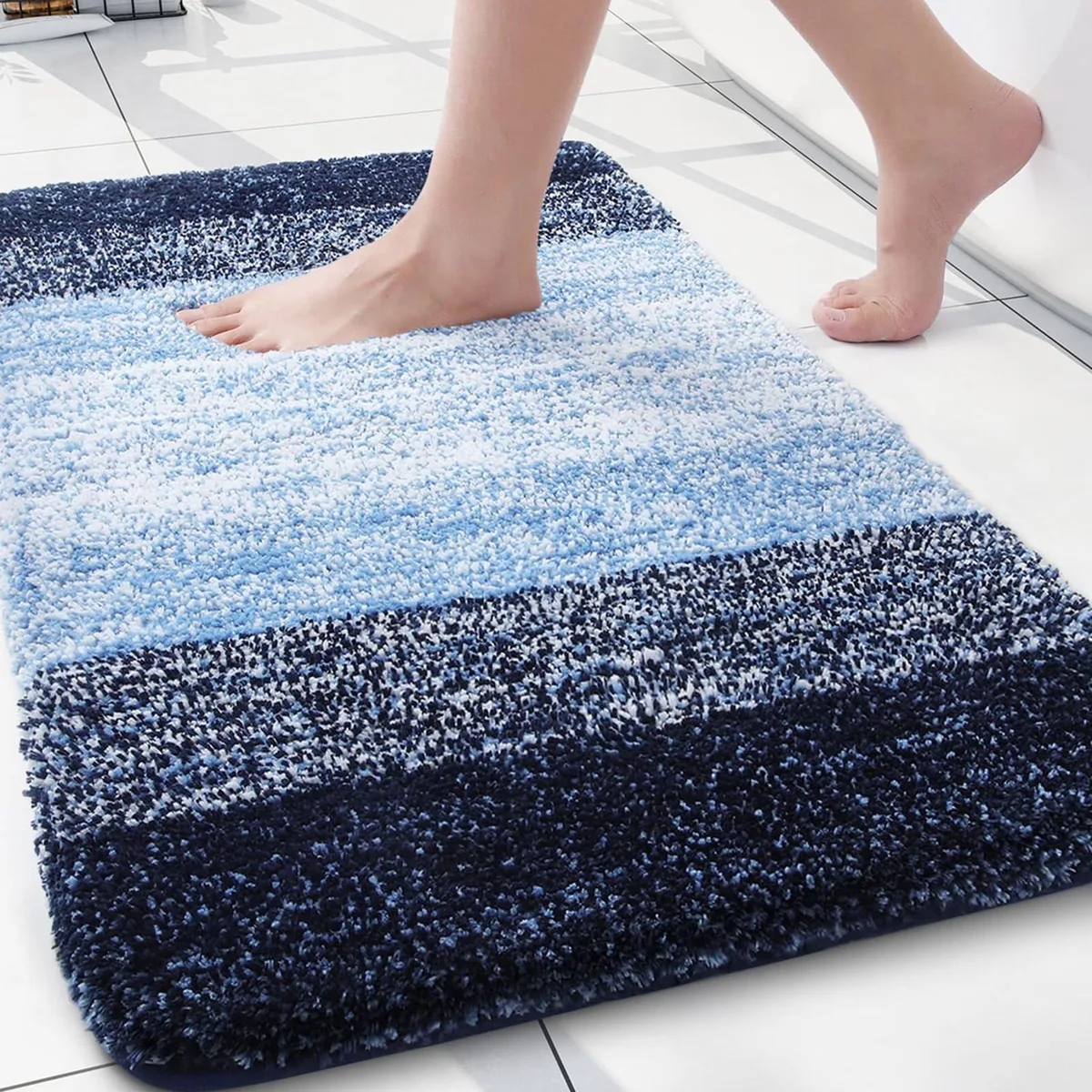 Rectangular blue microfiber bath rug with shaggy pile and rubber backing