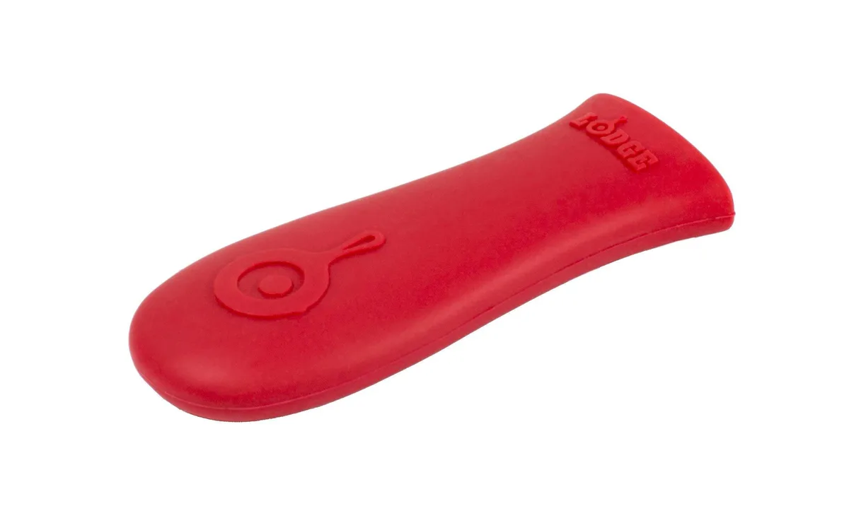 Red silicone handle sleeve with textured grip for cast iron skillets