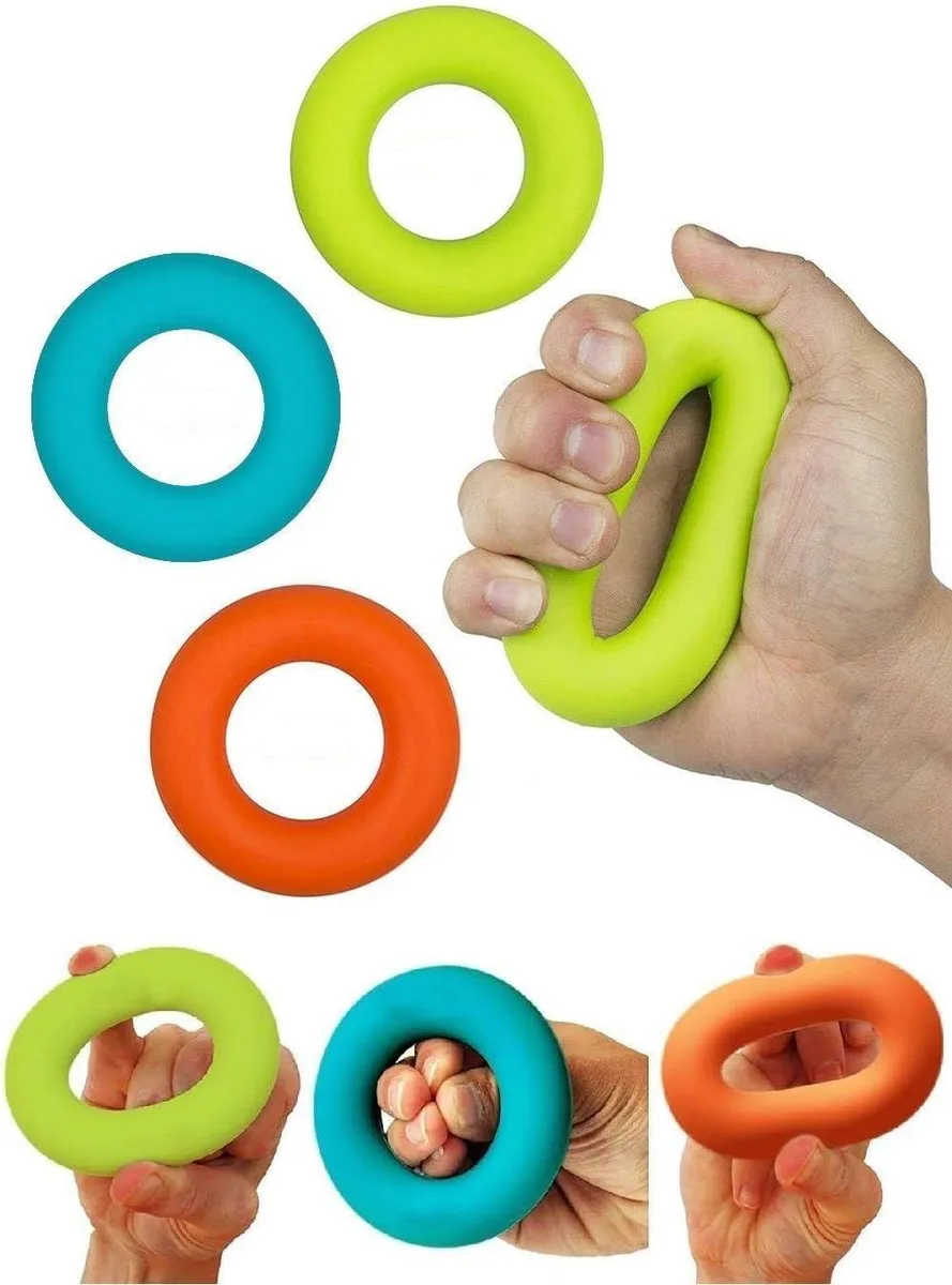 Three silicone grip rings in green blue orange on a flat surface