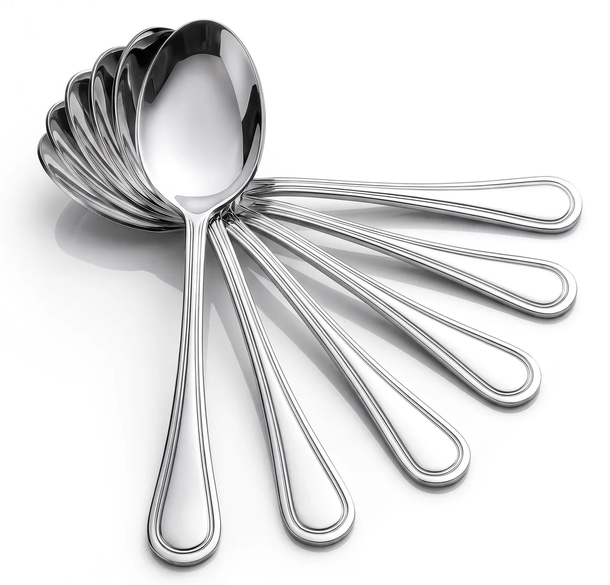 Six silver stainless steel teaspoons with engraved line handles