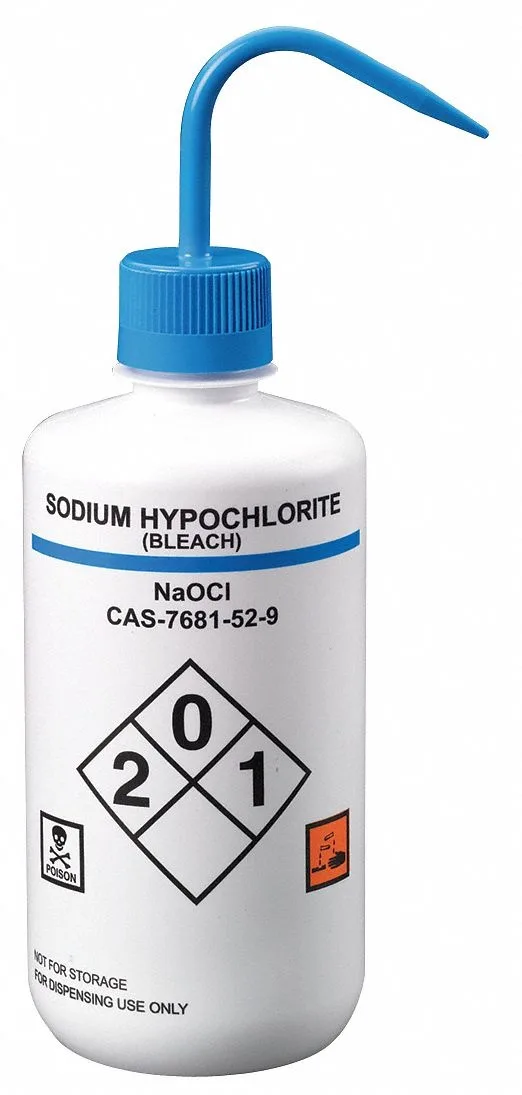 Four white plastic wash bottles with blue caps standing upright