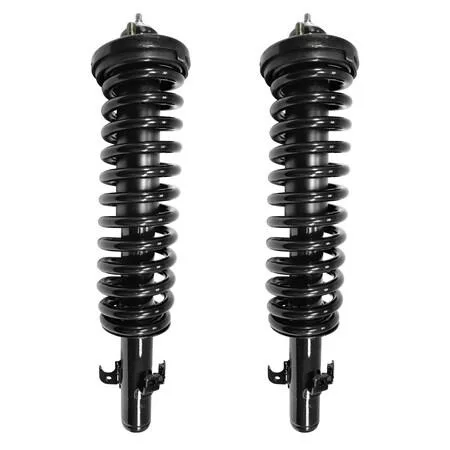 Two silver front strut assemblies with coiled springs and top mounts
