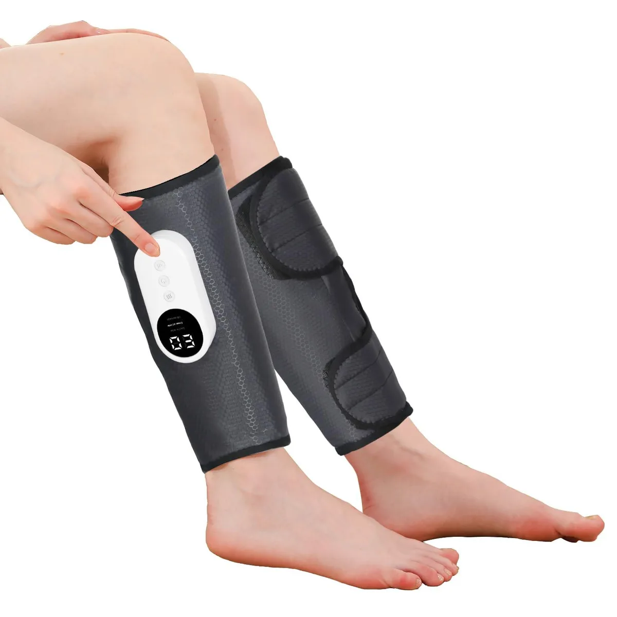 Grey fabric calf compression wrap with Velcro straps and a small control unit