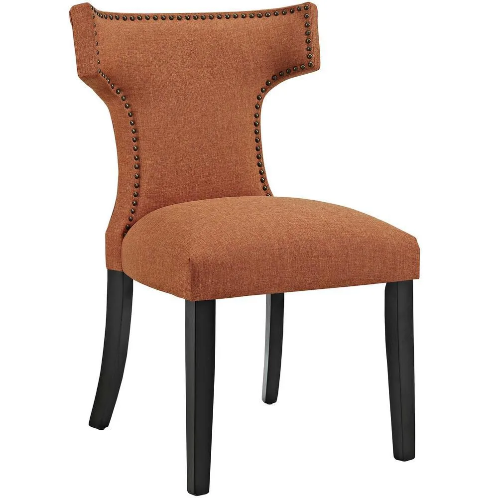 Orange fabric dining chair with black rubberwood legs and nailhead trim