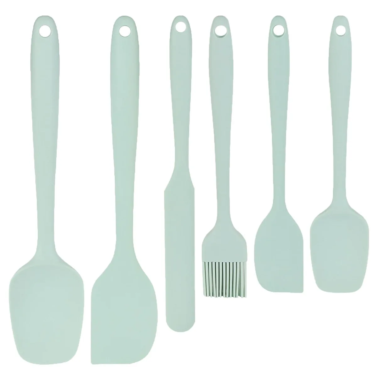 Six green silicone spatulas and brush on white background
