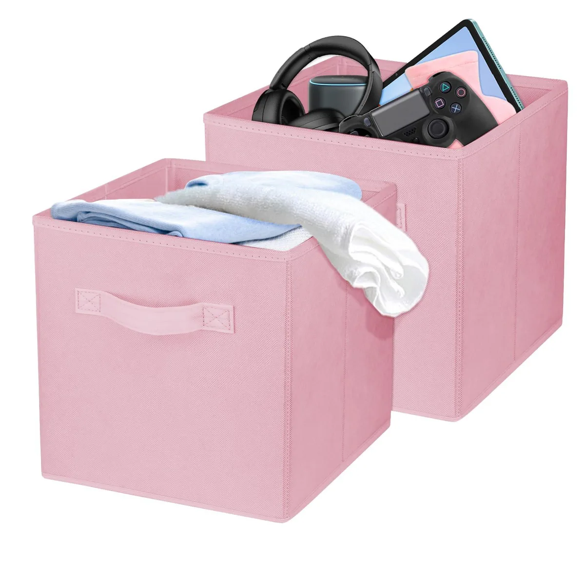 Two pink fabric collapsible storage bins with side handles, square cube shape