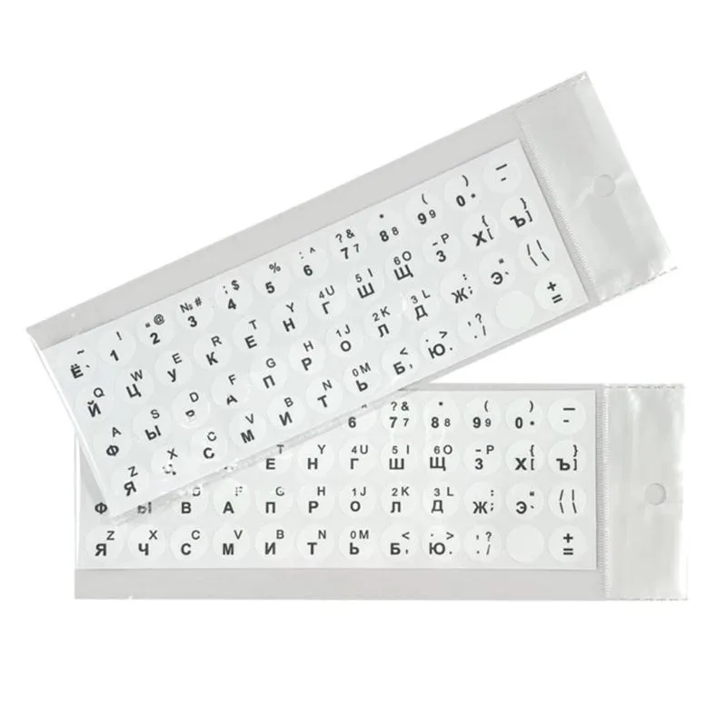 Two thin white-on-black PVC keyboard sticker sheets, 19 by 6.7 cm