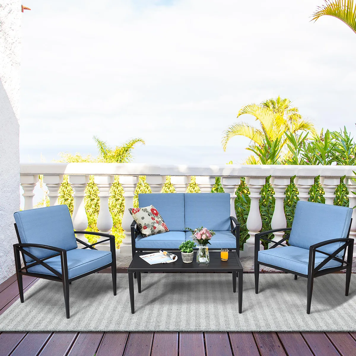 Blue four-piece patio set: two single chairs, a loveseat, and a side table with black aluminum frames and blue cushions