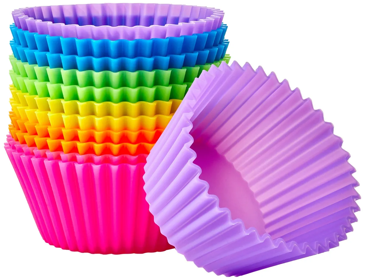 Twelve multicolour silicone baking cups in a grid, flexible round form, matte finish