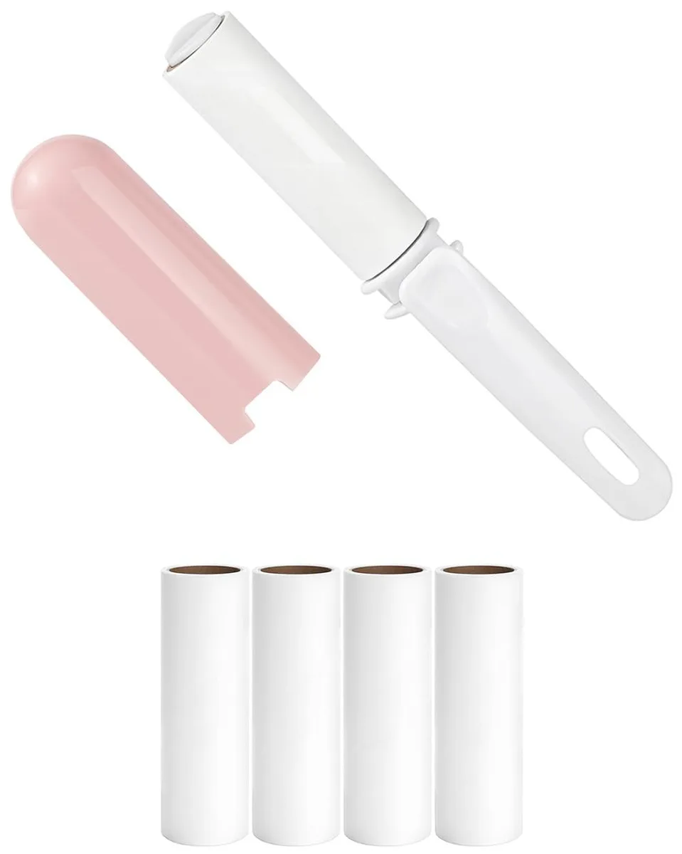 Pink mini lint roller with cover and four refill rolls, compact foldable design
