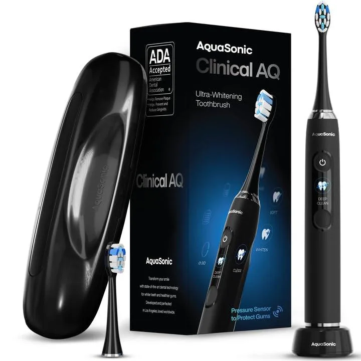 Black electric toothbrush handle with LCD screen, two brush heads, inductive charger and hard travel case
