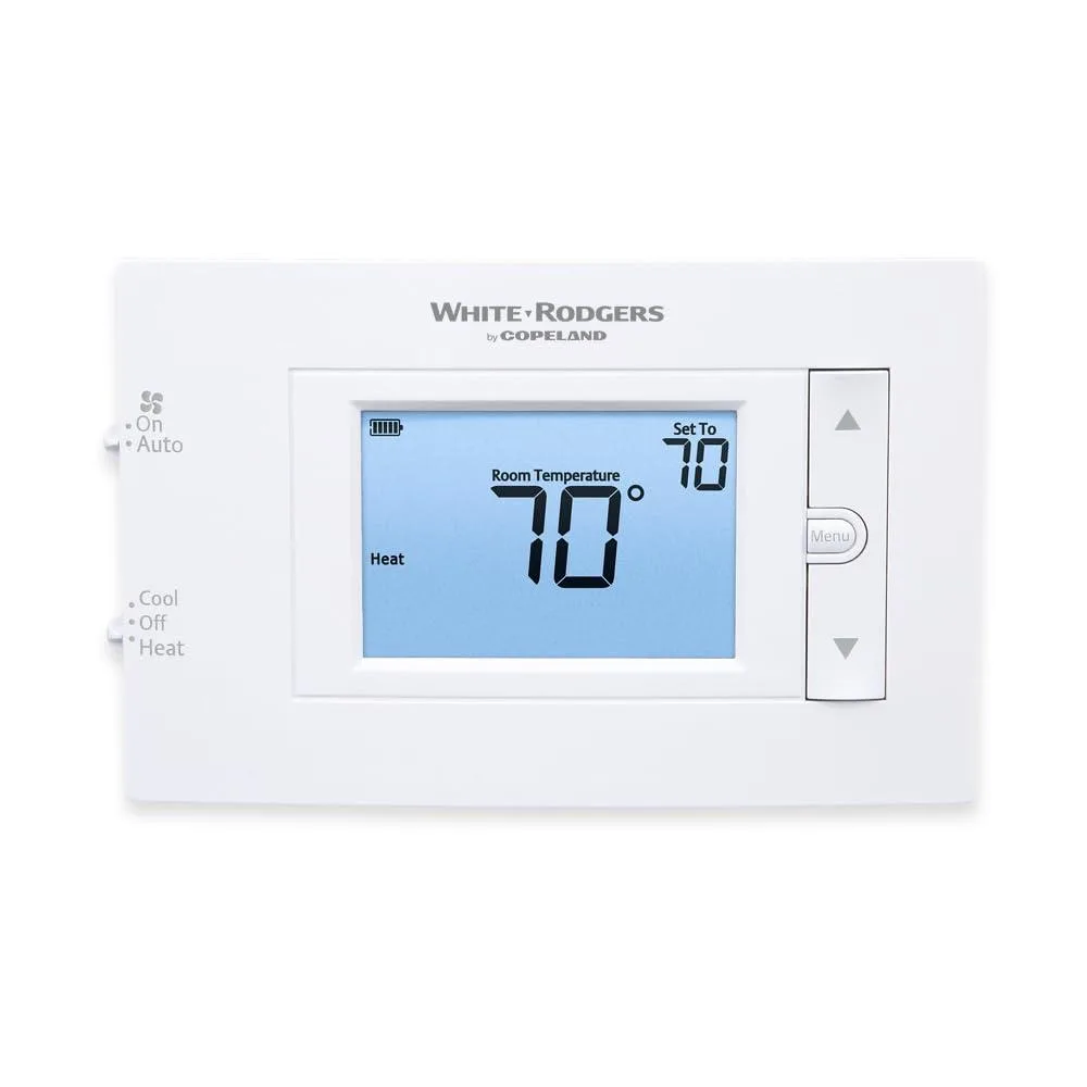 White rectangular wall thermostat with push buttons and backlit display