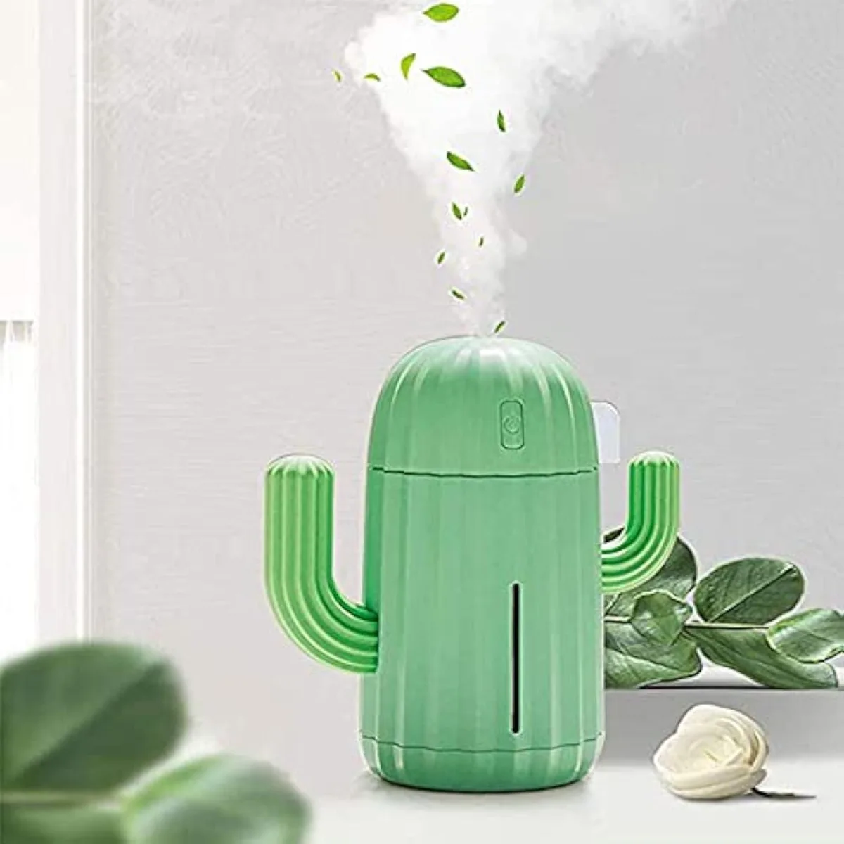 Small green cactus-shaped humidifier with rounded branches, matte finish, USB cable attached