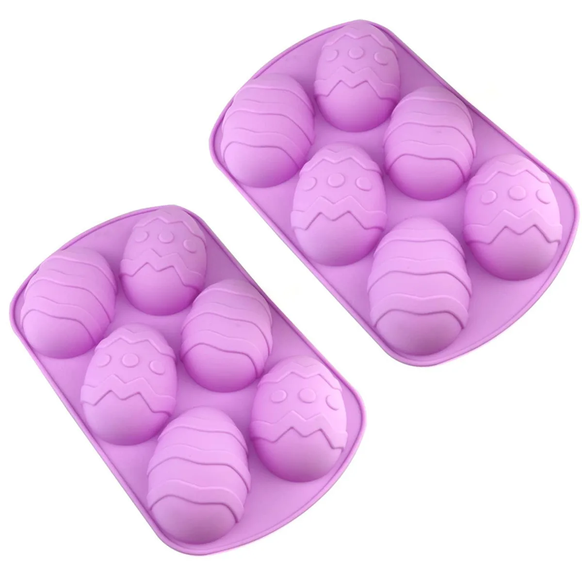 Two flexible egg-shaped silicone moulds, pale colour, shallow cavities
