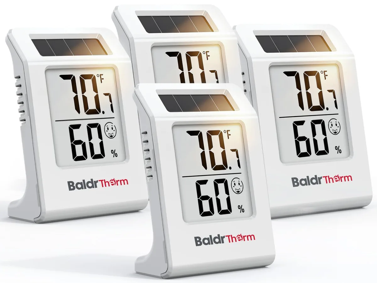Black infrared thermometer with digital display showing temperature and humidity