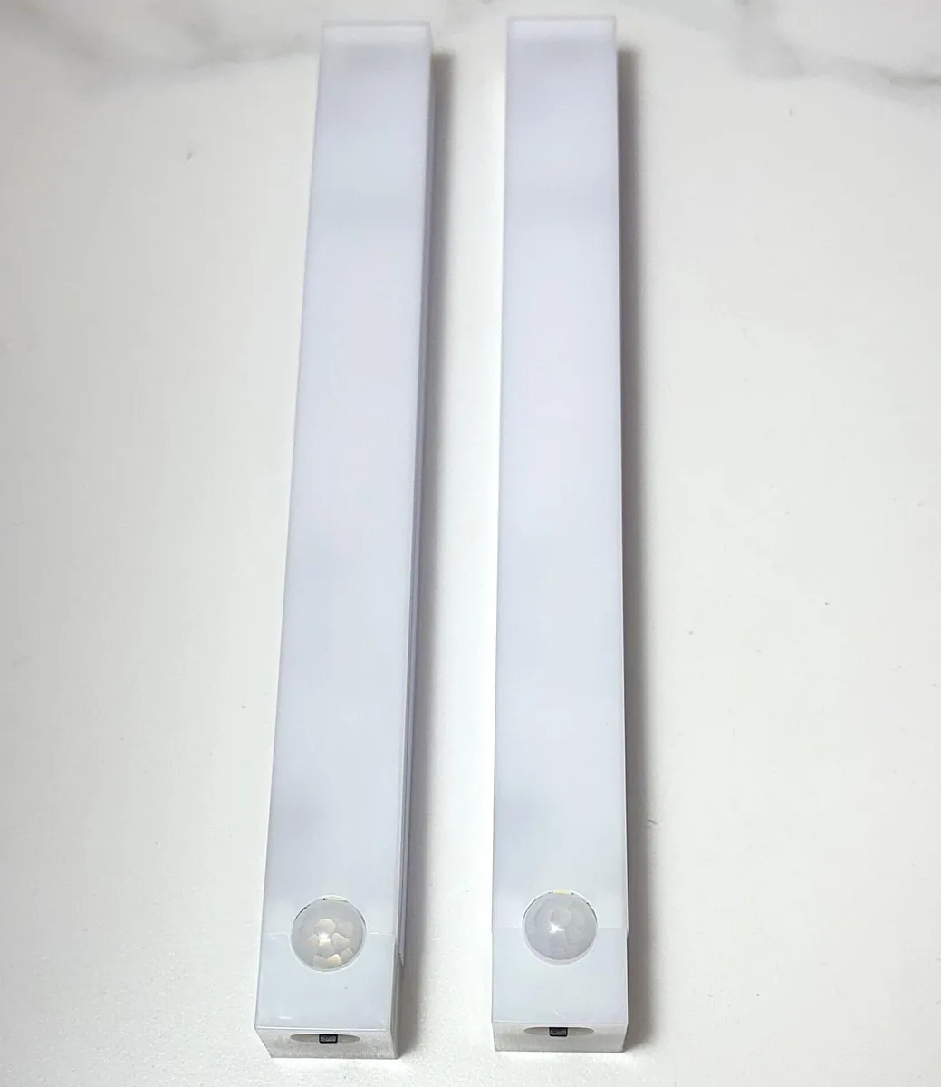 Two white 8-inch LED bars with magnetic mounts and USB cords