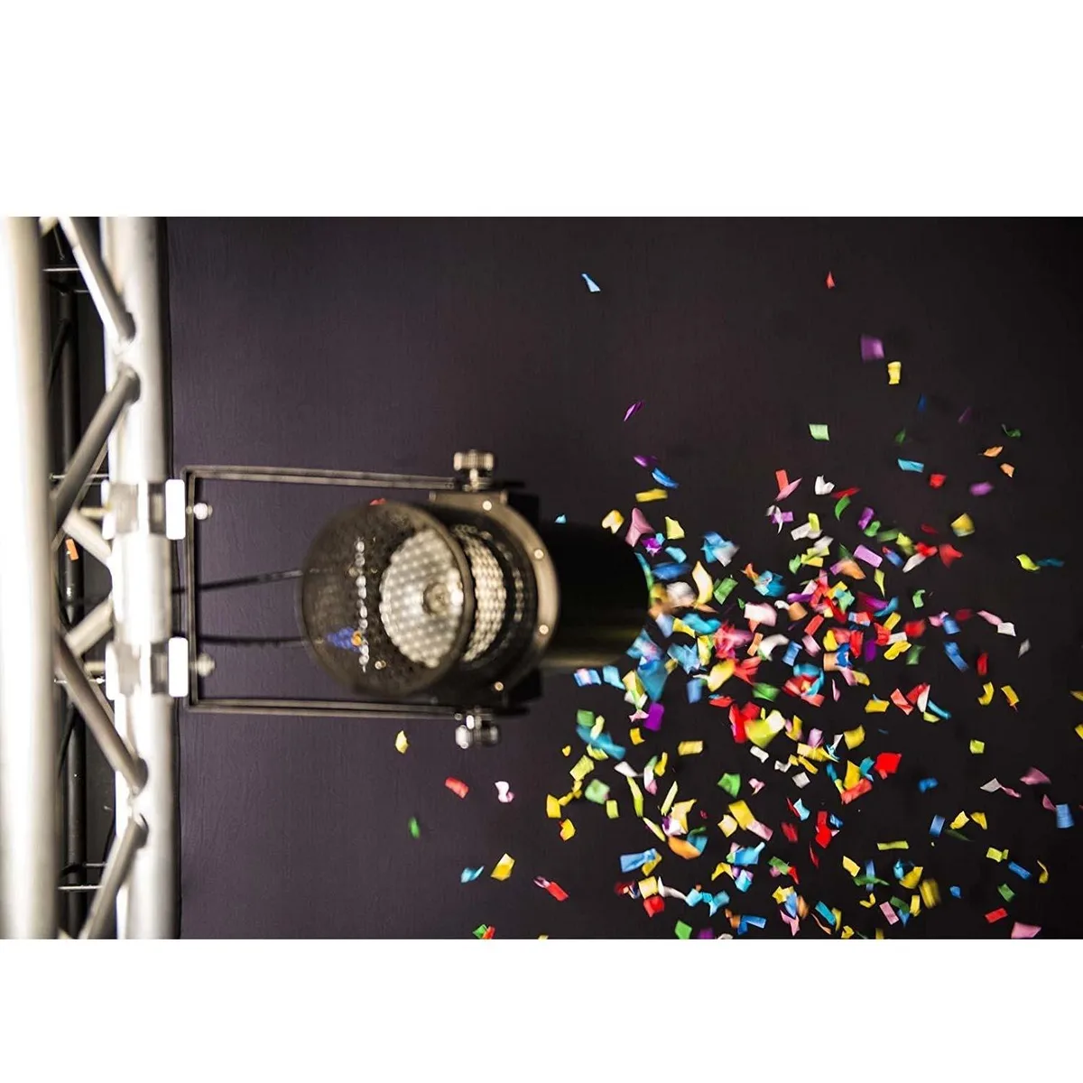 A rectangular cardboard box with multicoloured paper confetti inside