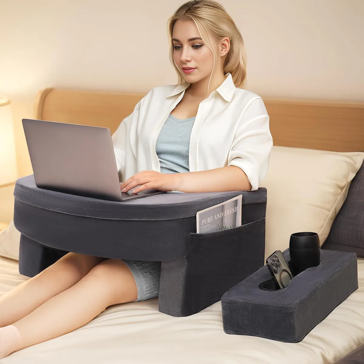 Grey lap pillow with wide armrests, side pockets and cup holder, memory foam interior, removable washable cover