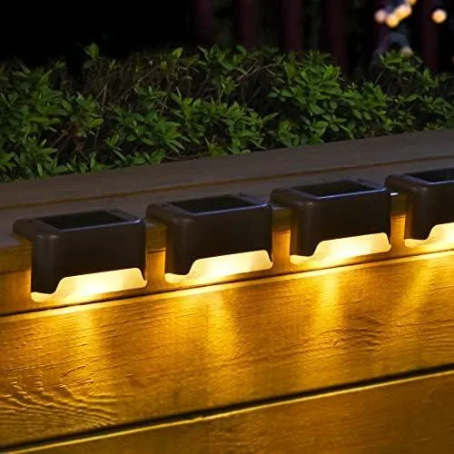 Twenty small brown square solar lights with clear prismatic tops arranged in a grid