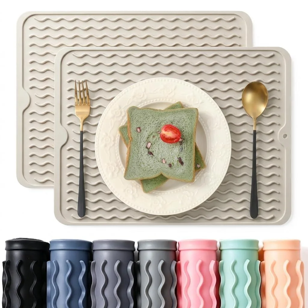 Two rectangular milk-coloured silicone mats with ribbed surface, 15 by 11.5 inches