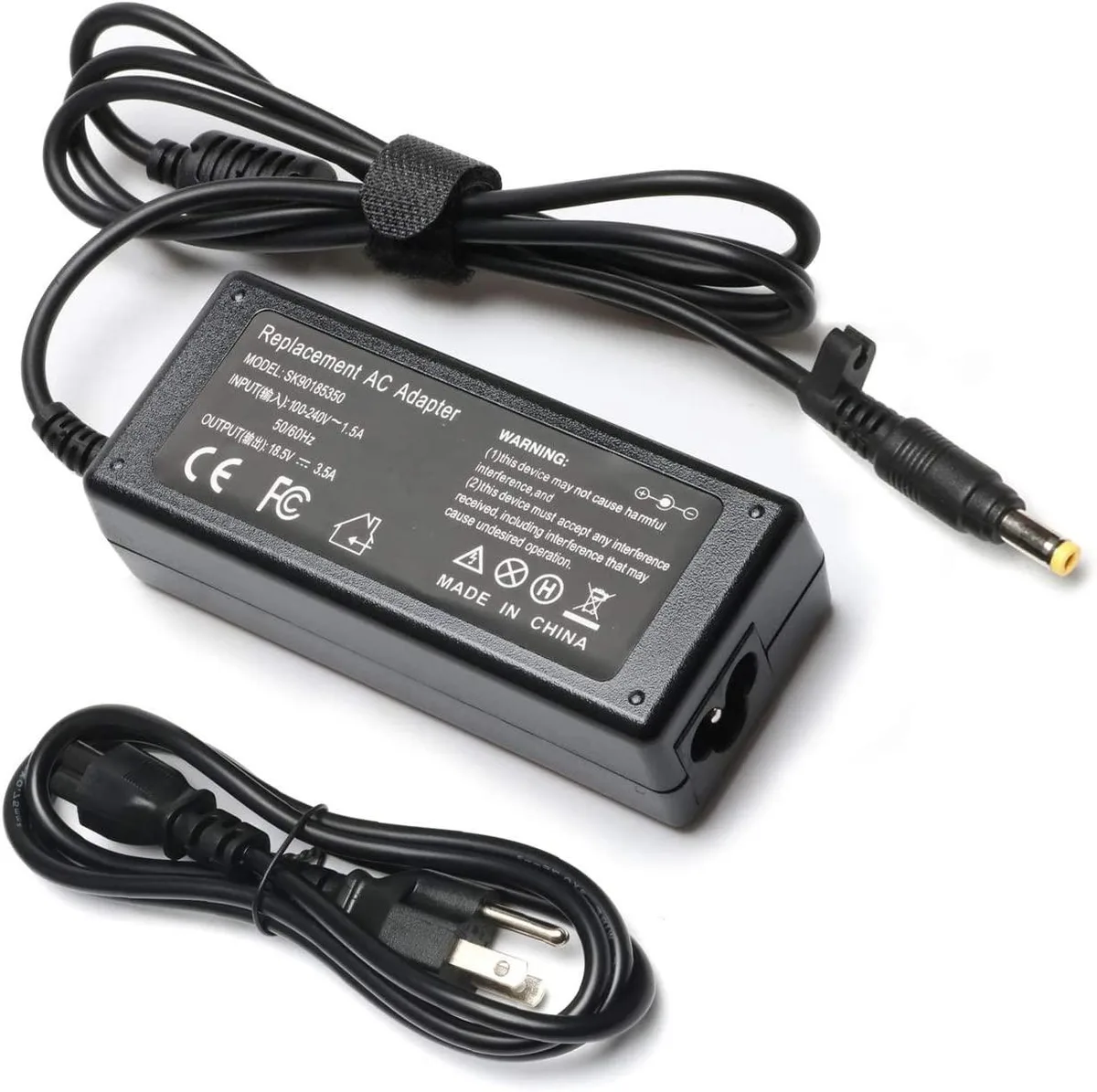 Black rectangular laptop power brick with 3-prong plug and 4.8mm barrel connector