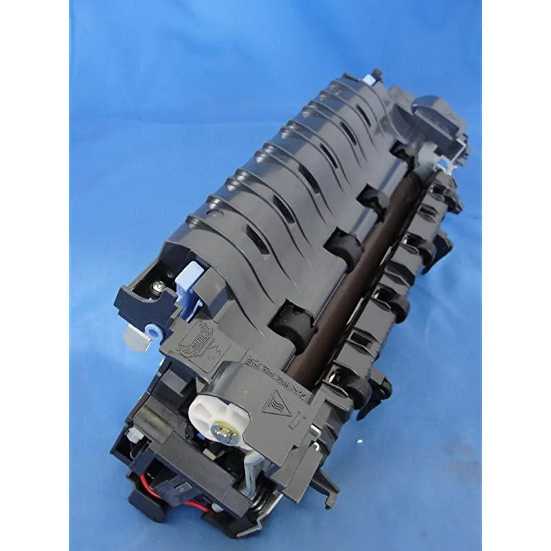 Rectangular black fuser unit with silver rollers and green circuit board visible