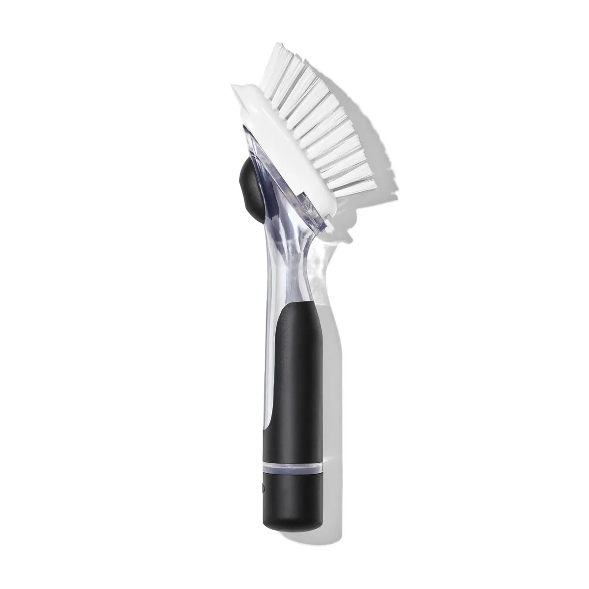 White soap-dispensing dish brush with contoured non-slip handle and built-in scraper