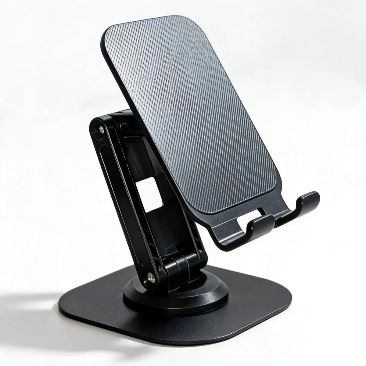 Tan foldable phone stand with adjustable arms and base