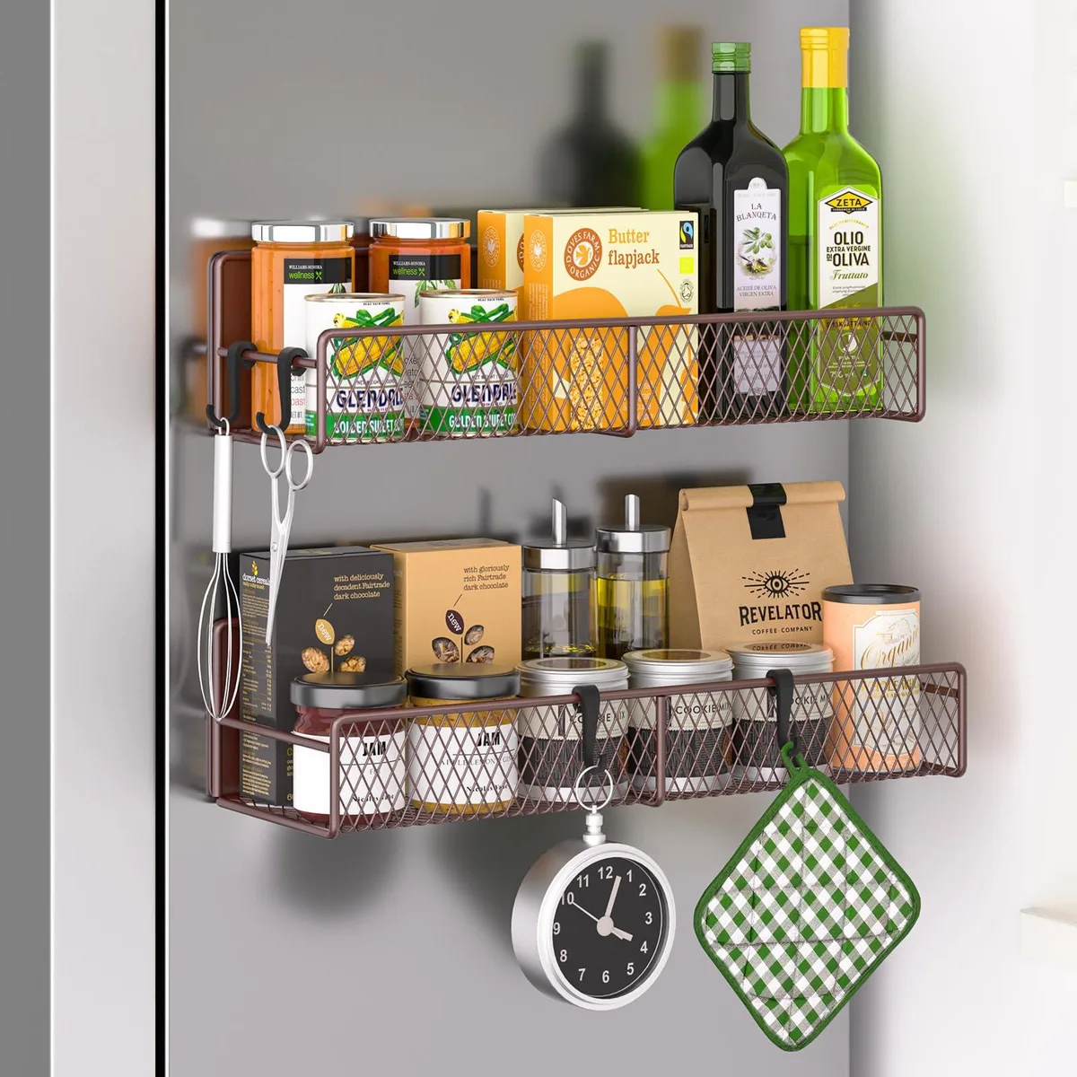 Two red metal spice racks with hooks on fridge