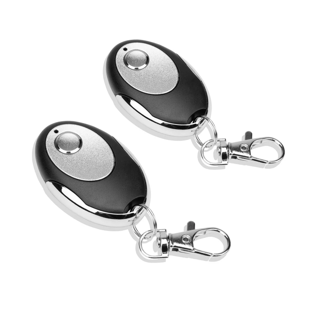 Two compact purple-button garage door remotes on a metal keychain ring