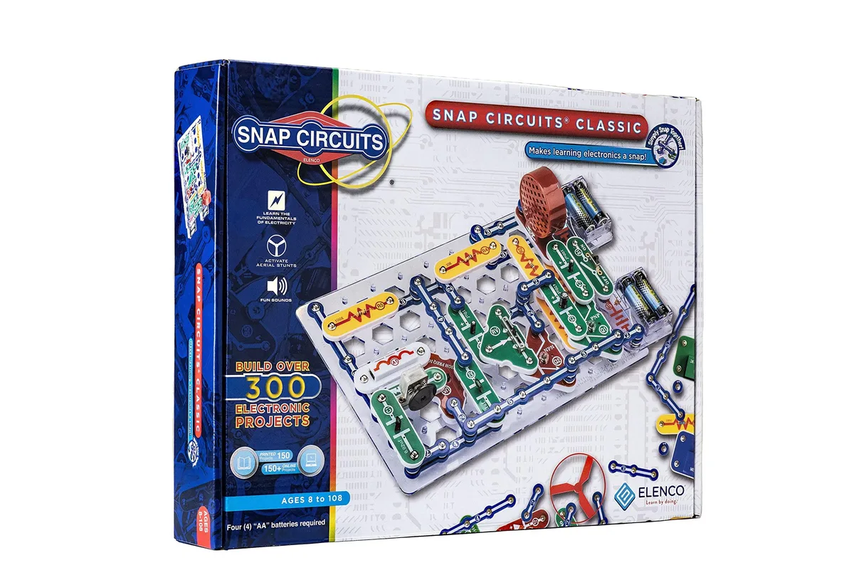 Colourful plastic electronics kit with snap-together components on grid board, boxed
