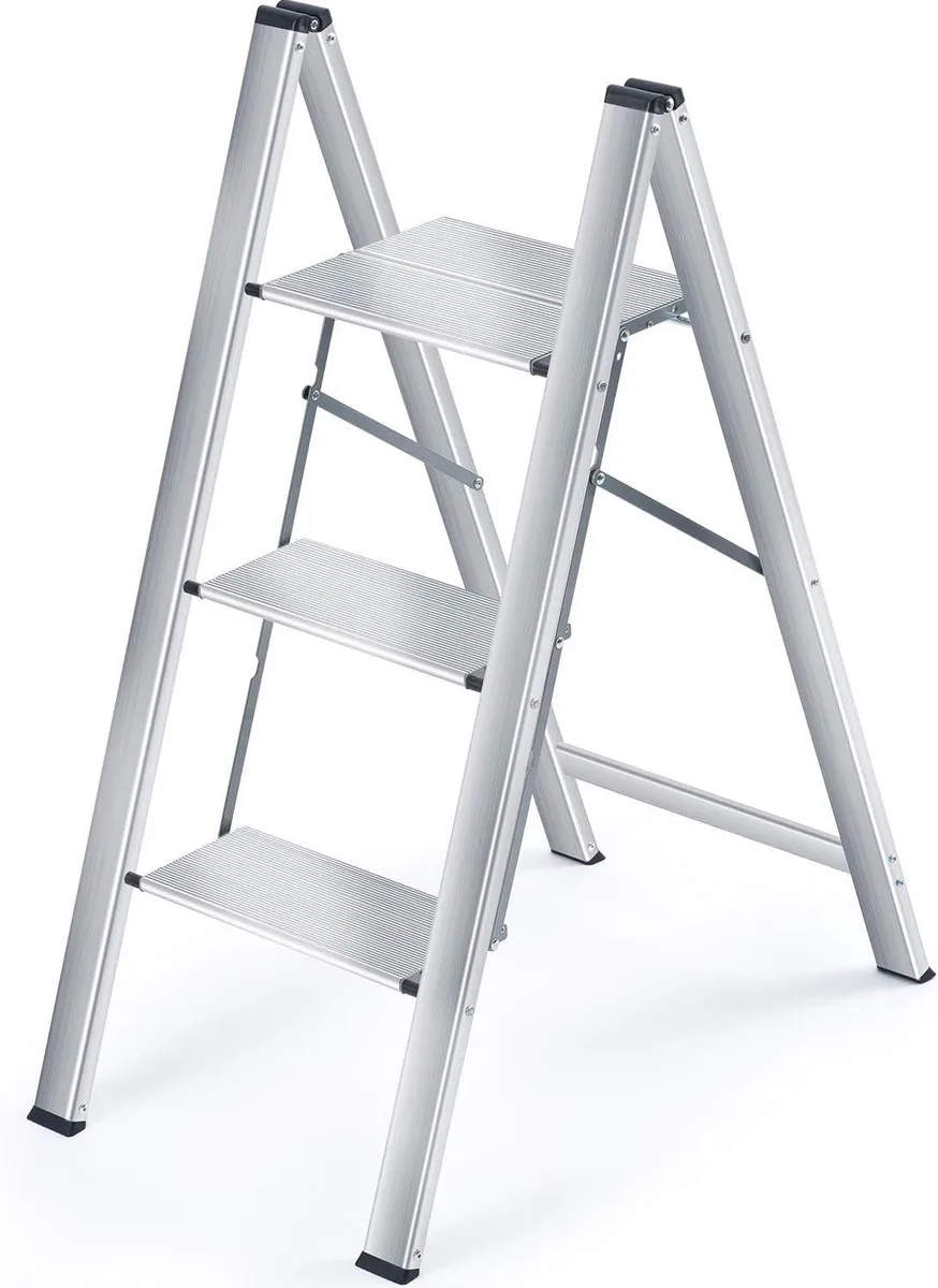 Silver aluminium three-step ladder folded to 1.6 inch profile