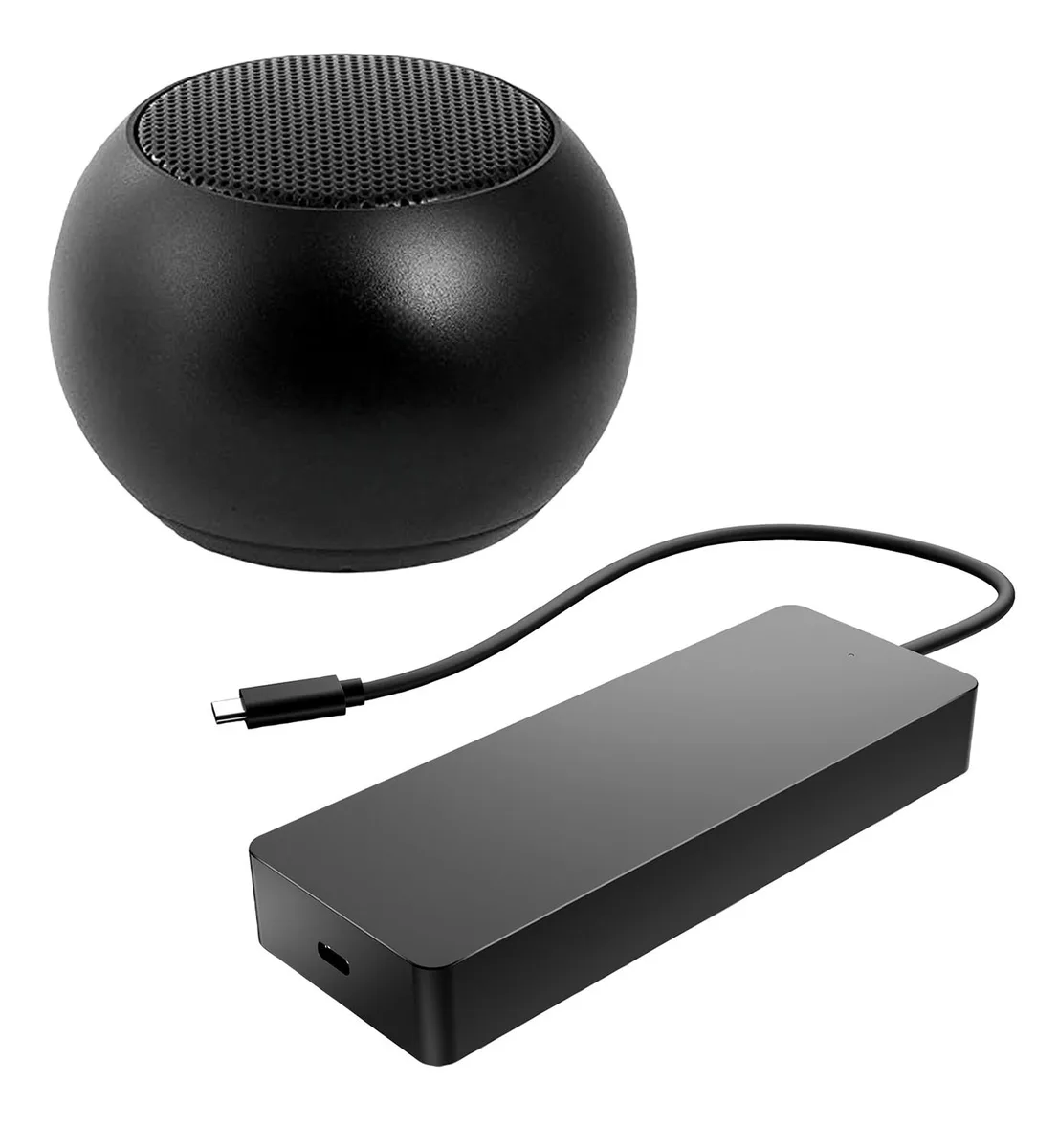 A compact grey docking hub beside a tiny round Bluetooth speaker