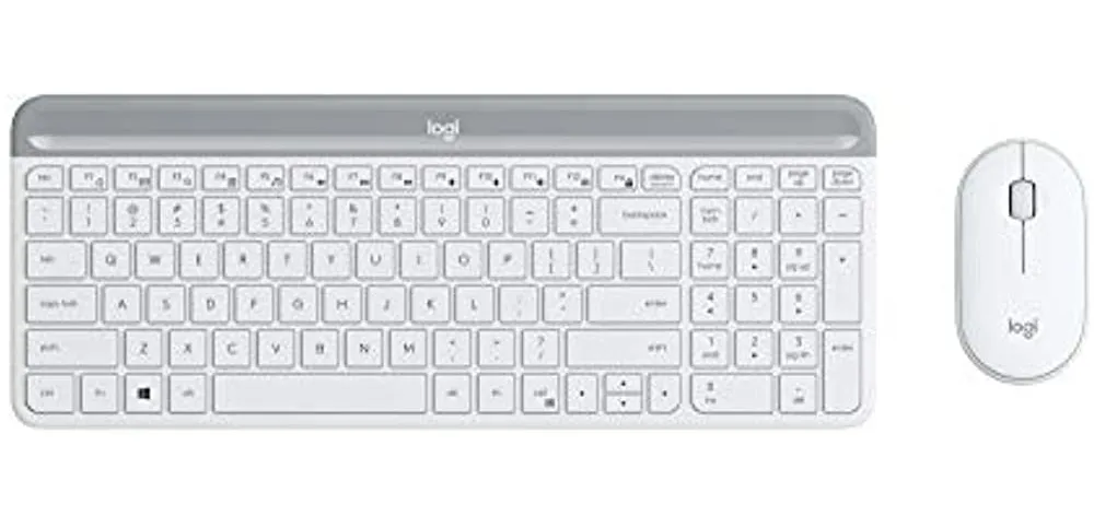 White compact wireless keyboard with number pad and matching ambidextrous mouse on desk