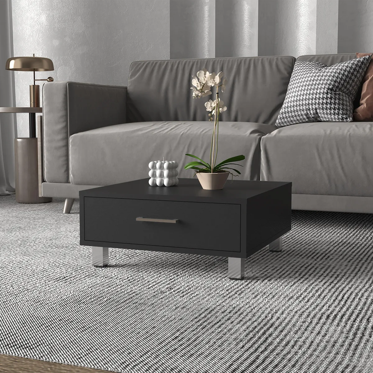 Black rectangular coffee table with one drawer, four metal legs and metal handle