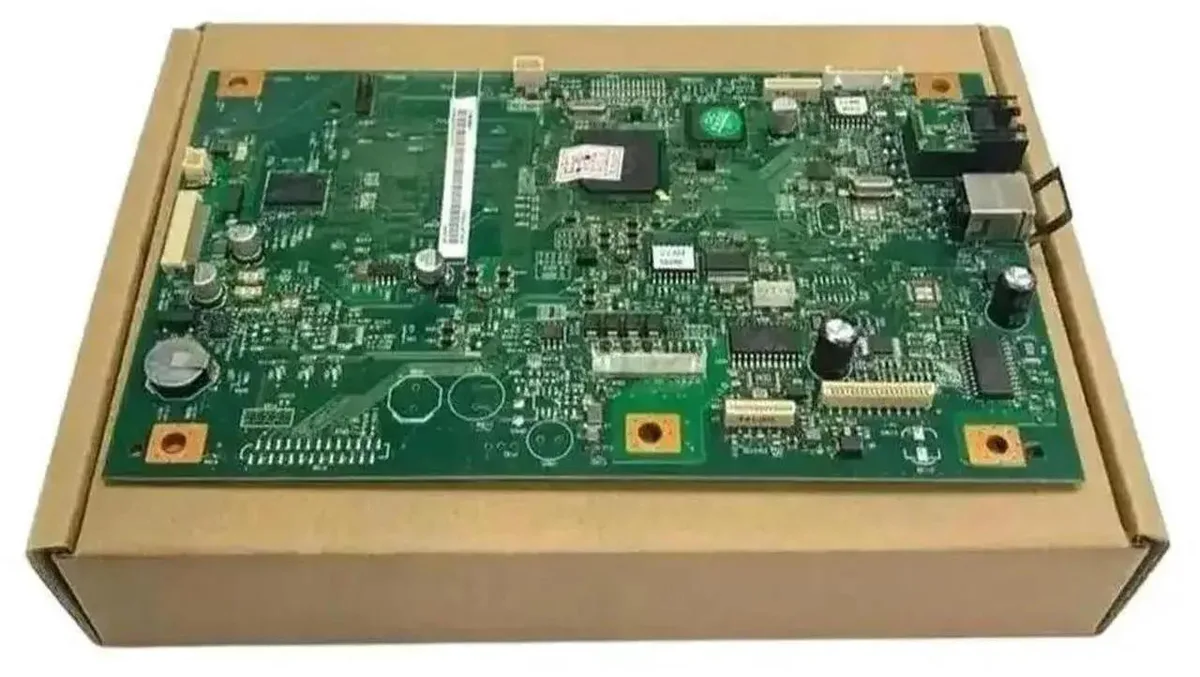 Green rectangular circuit board with silver ports and black chips