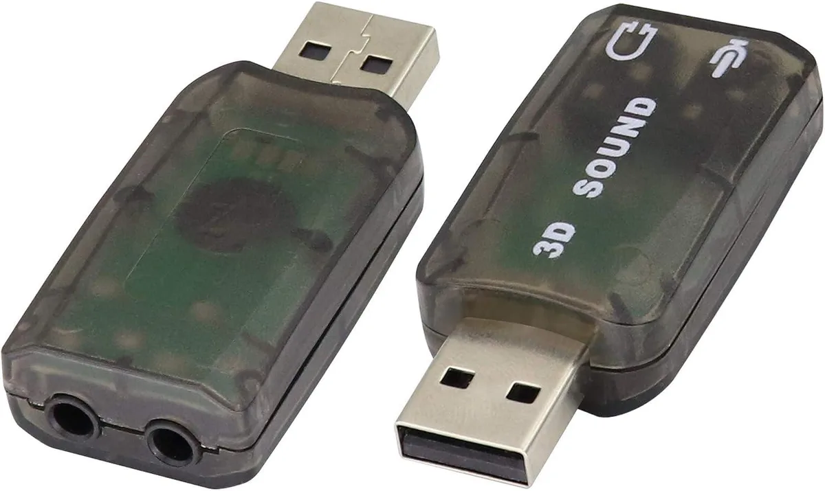 Two small black USB 2.0 audio adapters with 3.5 mm headphone and microphone jacks