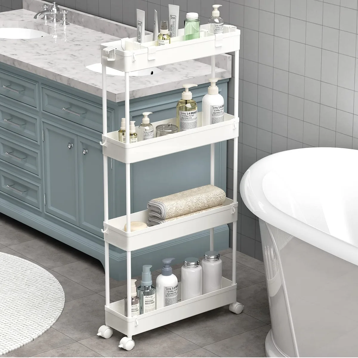 White four-tier slim storage cart on four casters, 4.9 inches wide, open plastic shelves with side rails
