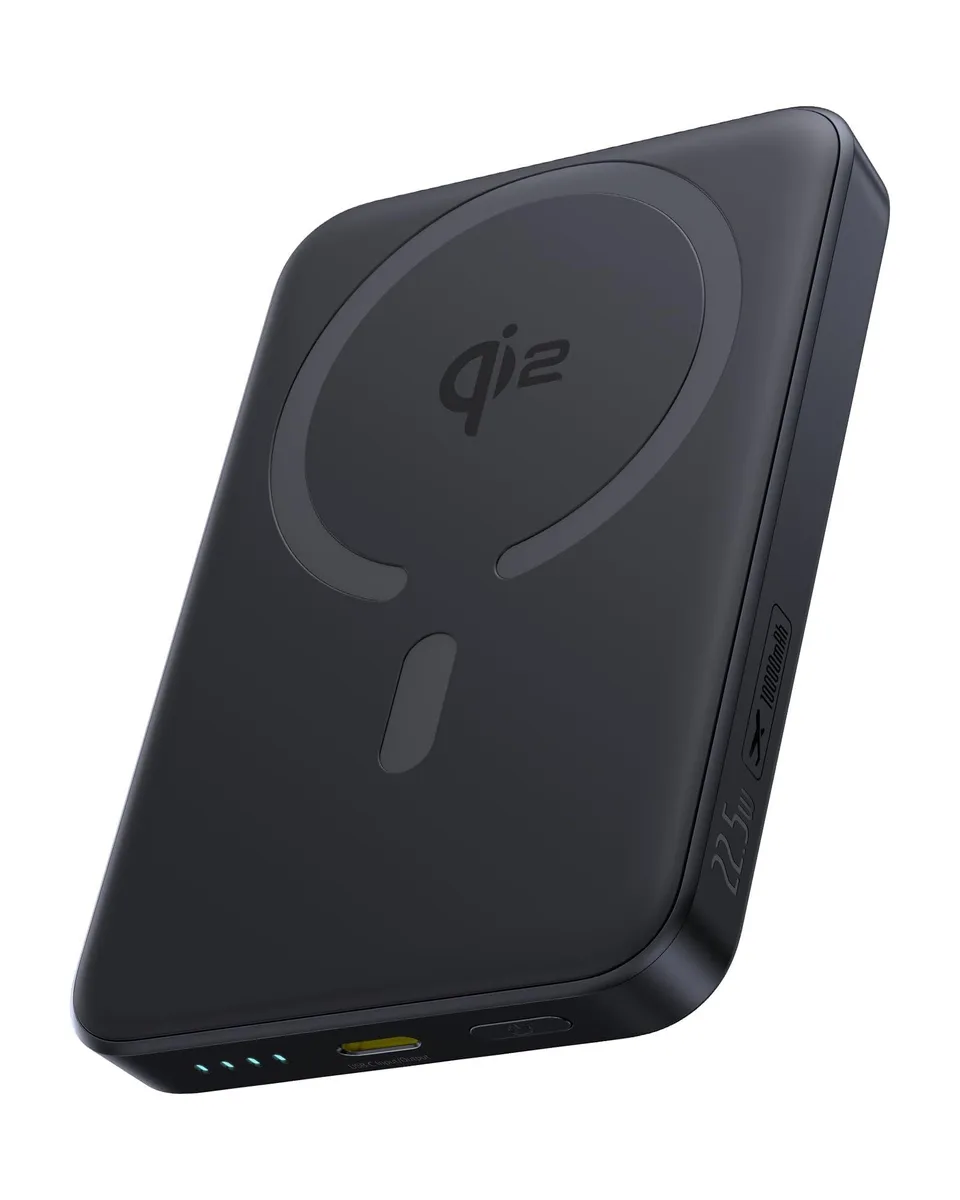 Black rectangular power bank with rounded edges, silicone-metal finish, USB-C cable attached