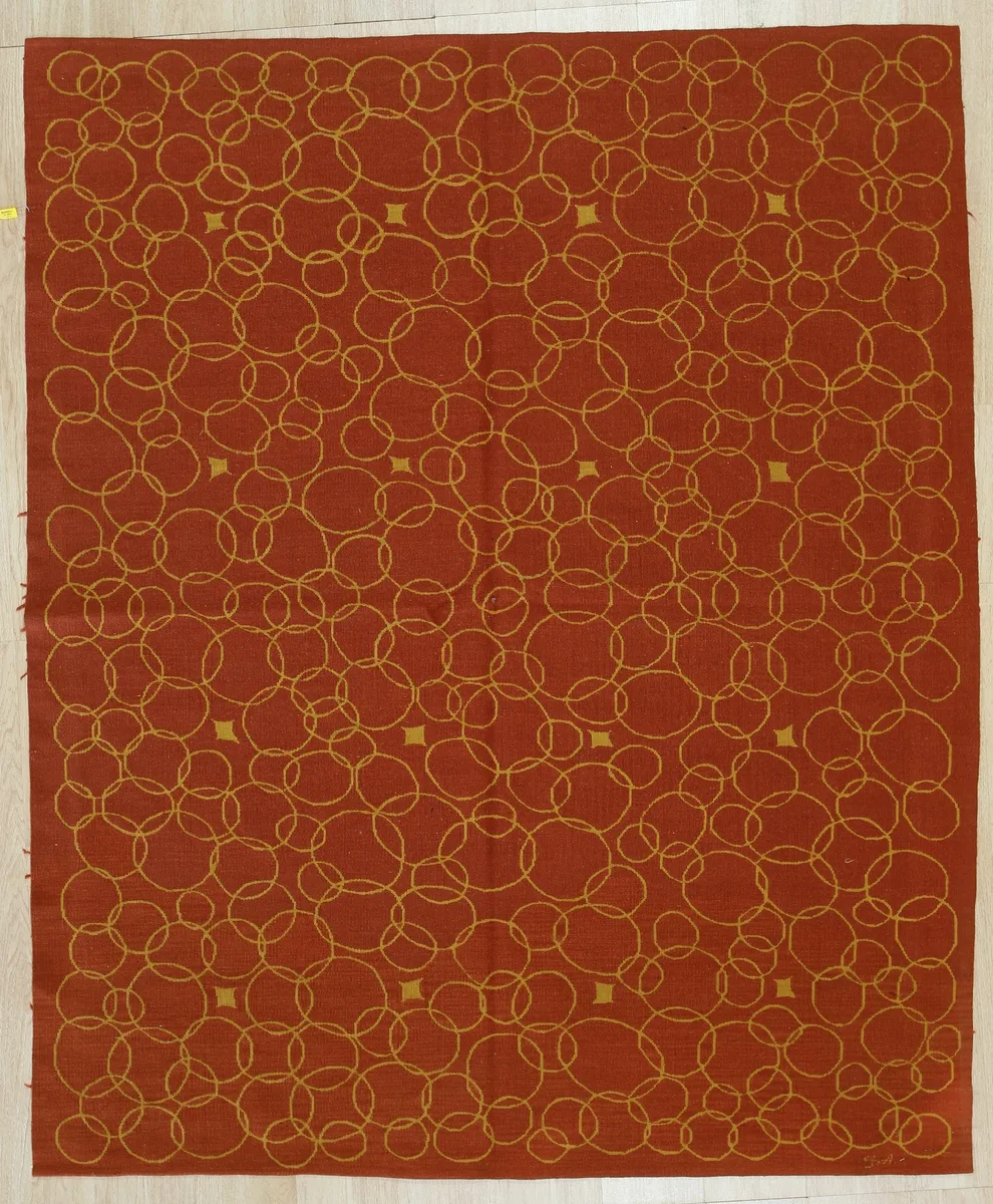 Handwoven red flatweave wool rug with geometric pattern