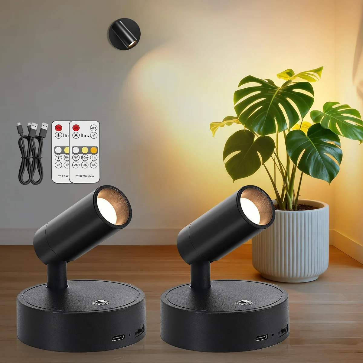 Two black wireless LED spotlights with remote control, plastic finish, freestanding or wall-mountable