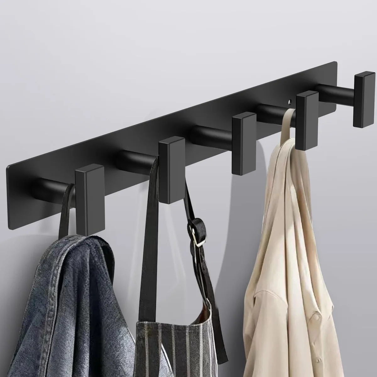 Black wall-mounted coat rack with five evenly spaced hooks, 16.5 inches long